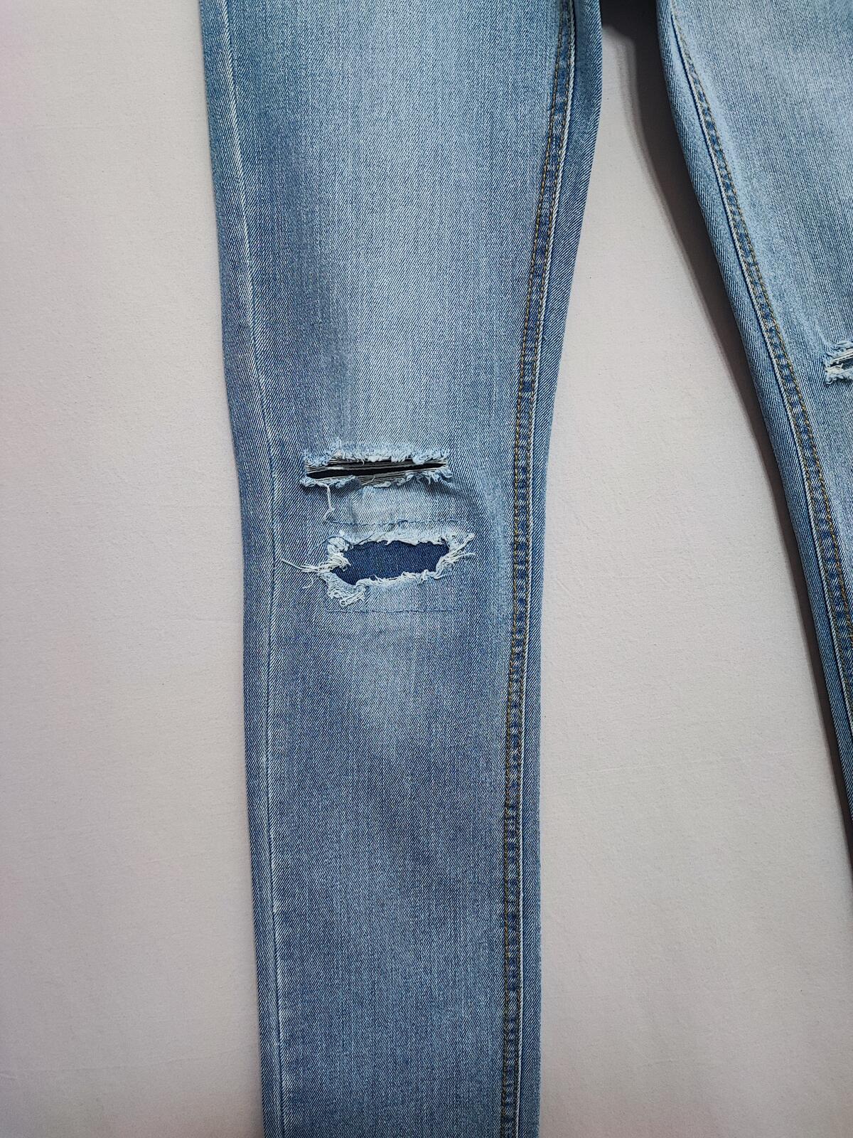 Vintage Levi's 510 Skinny Jeans Faded Blue Ripped Knee Youth Kids W27 L29