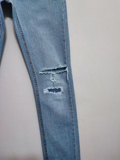 Vintage Levi's 510 Skinny Jeans Faded Blue Ripped Knee Youth Kids W27 L29
